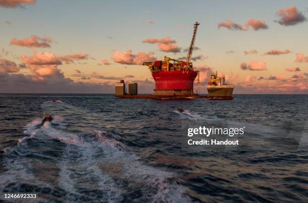 Greenpeace activists speed towards and board a Shell oil platform being transported by the White Marlin ship on January 31, 2023 in the Atlantic...