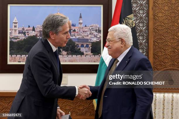 Palestinian President Mahmud Abbas and US Secretary of State Antony Blinken shake hands following their meeting in Ramallah in the occupied West...