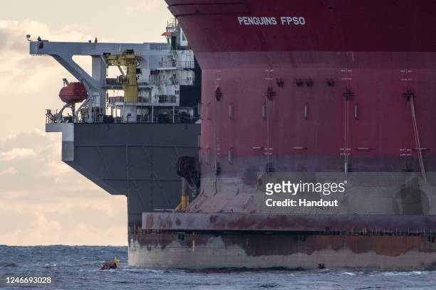 Greenpeace activists board a Shell oil platform being transported by the White Marlin ship on January 31, 2023 in the Atlantic Ocean north of Gran...
