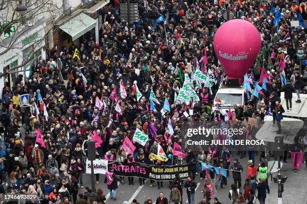 Members of the Solidaires trade unions group march during a rally on a second day of nationwide strikes and protests over the government's proposed...