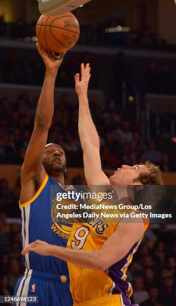 Golden State Warriors guard Ian Clark shoots over Los Angeles Lakers guard Marcelo Huertas in the 4th quarter. The Golden State Warriors defeated the...
