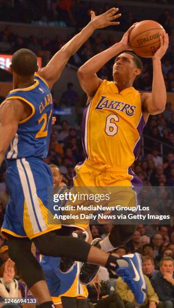 Los Angeles Lakers guard Jordan Clarkson takes a shot against Golden State Warriors guard Ian Clark in the first half. The Los Angeles Lakers Played...