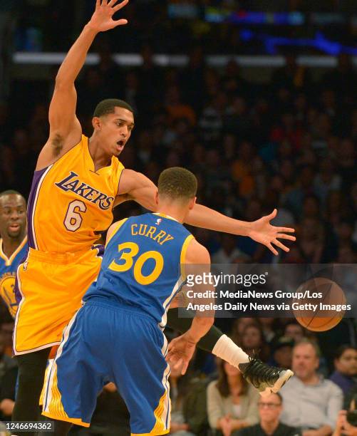 Los Angeles Lakers guard Jordan Clarkson kicks a ball passed by Golden State Warriors guard Stephen Curry in the first half. The Los Angeles Lakers...