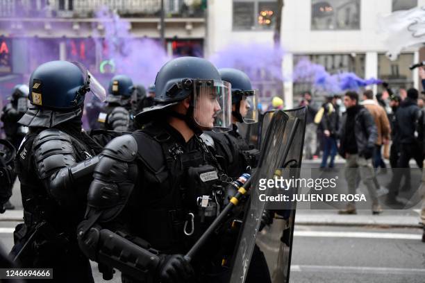 French gendarmes stand in formation during a rally on a second day of nationwide strikes and protests over the government's proposed pension reform,...