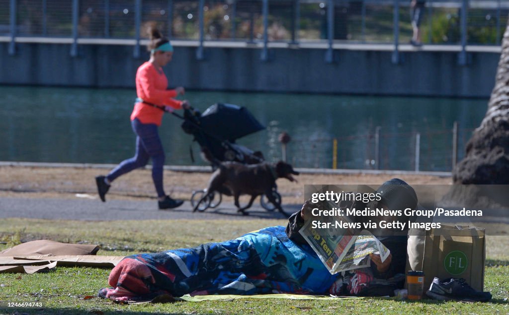 Homeless While Raining Homeless people camp out near Echo Park Lake in Los Angeles, CA News ...