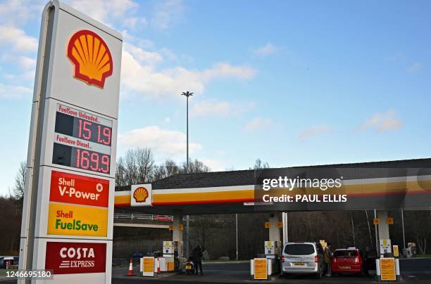 The price of a litre of unleaded and diesel fuels is displayed on an electronic board outside a Royal Dutch Shell petrol station in Gateshead, north...