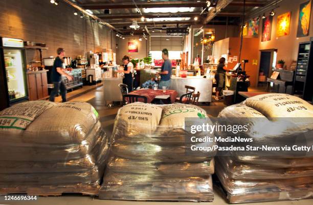Bags of green coffee beans from around the world on pallets to be roasted Monday September 13, 2010. Jones Coffee Roasters, a fixture for java lovers...