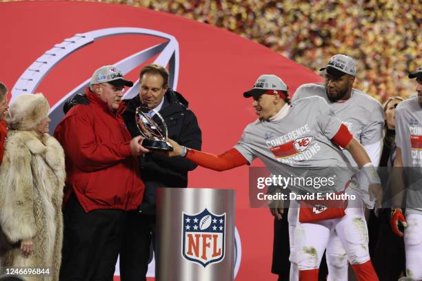 Championship: Kansas City Chiefs Patrick Mahomes hands the Lamar Hunt trophy to head coach Andy Reid following victory vs Cincinnati Bengals at...