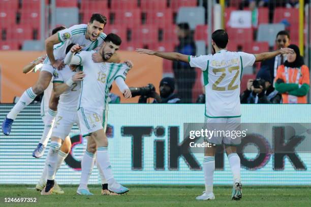 Algeria's midfielder Mohamed Bakir and teammates celebrate a goal during the 2022 African Nations Championship semi-final football match between...