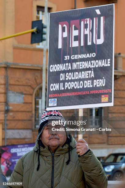 People protest in front of the Peruvian embassy in Italy with placards and banners against the Peruvian parliament accused of corruption and...