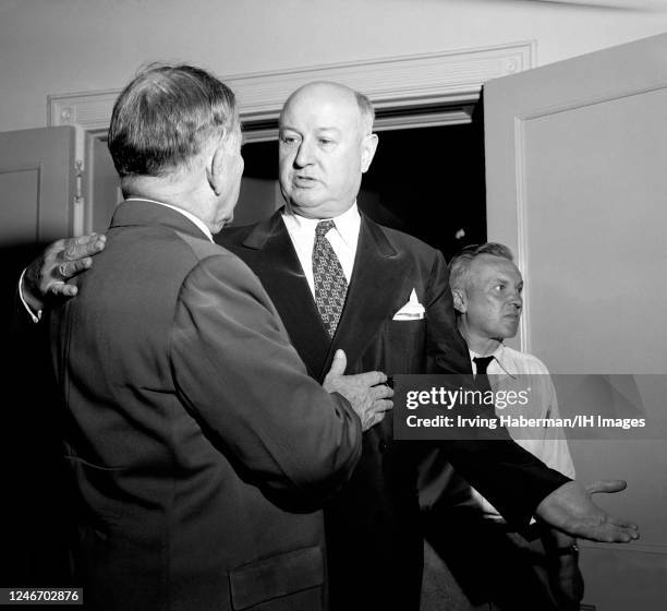 Former United States Postmaster General James A. Farley talks with American lawyer, politician from Kentucky and the running mate of President Harry...