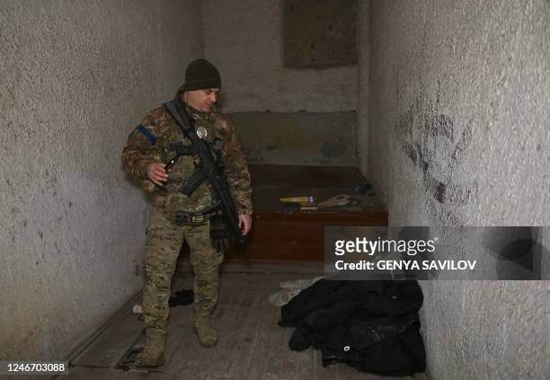 Ukrainian policeman walks in a basement of the regional police headquarters, allegedly used as a torture site of pro-Ukrainian citizens during the...