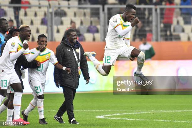 Senegal's players celebrate winning the 2022 African Nations Championship semi-final football match between Senegal and Madagascar at the Nelson...