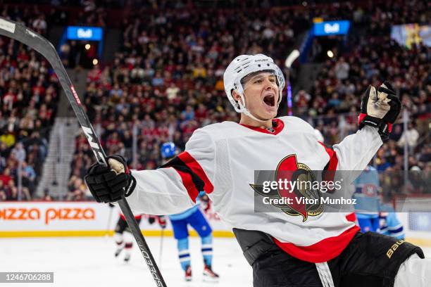 Tim Stützle of the Ottawa Senators celebrates after a goal during the third period of the NHL regular season game between the Montreal Canadiens and...