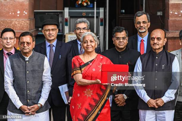 Nirmala Sitharaman, India's finance minister, center, and other members of the finance ministry leave the ministry to present the budget at the...