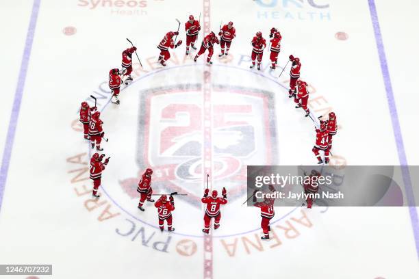 Carolina Hurricanes celebrate their win with a storm surge at the end of overtime of the game against the against the Los Angeles Kings at PNC Arena...