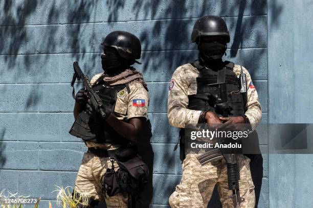 Police take measures at the funeral of three police officers killed by armed gangs, at the National Police Academy in Port-au-Prince, Haiti, on...