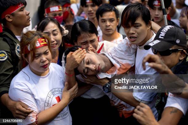Protesters perform during a demonstration outside the Embassy of Myanmar in Bangkok on February 1 to mark the second anniversary of the coup in...