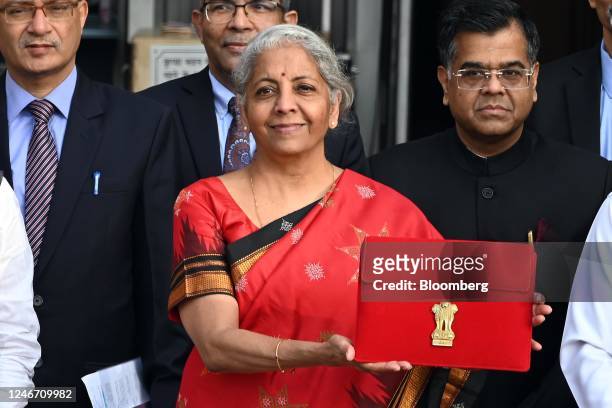 Nirmala Sitharaman, India's finance minister, center, and other members of the finance ministry leave the ministry to present the budget at the...