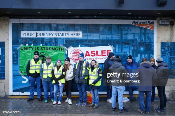 Striking train drivers on a picket line outside Leeds railway station during joint strike action by train drivers, teachers, university staff and...