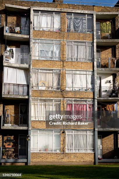 Dirty windows and closed curtains obscure the interiors of rented flats located on the South Circular, between Clapham and Streatham in south London,...