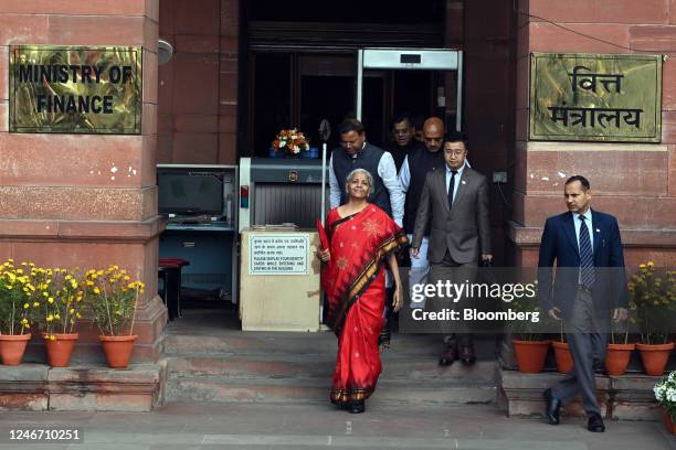 Nirmala Sitharaman, India's finance minister, center, and other members of the finance ministry leave the ministry to present the budget at the...