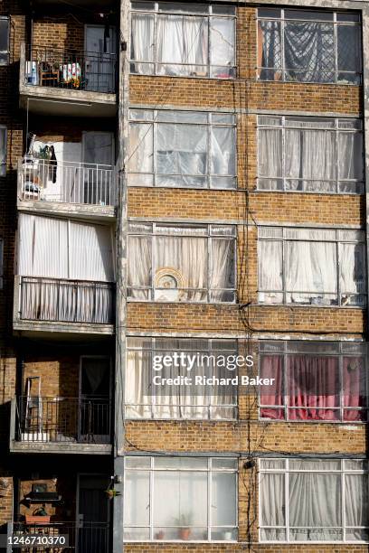 Dirty windows and closed curtains obscure the interiors of rented flats located on the South Circular, between Clapham and Streatham in south London,...