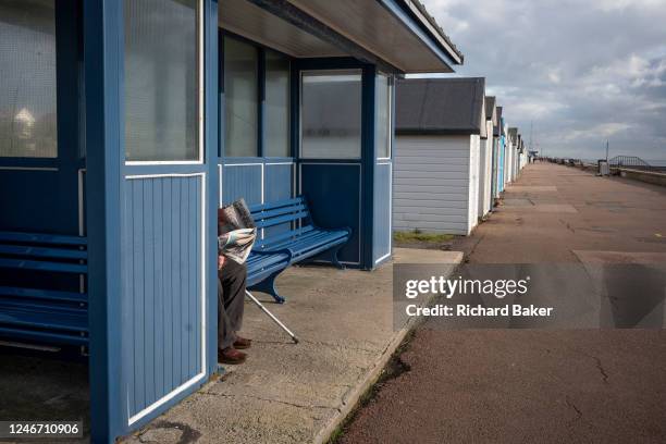 On the third anniversary of the UK leaving the European Union , a lone gentleman sits and reads his newspaper in on a bench at a beach shelter at...