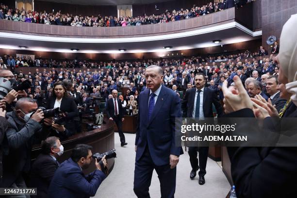 Turkish President and Leader of the Justice and Development Party Recep Tayyip Erdogan applauded as he attends his party's group meeting at the...