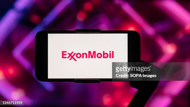 In this photo illustration, the logo of Exxon Mobil seen displayed on a mobile phone screen.