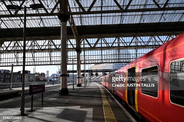 Photograph taken on February 1, 2023 shows a train stopped at a platform in Waterloo Station in London, during a national strike day. - Children...