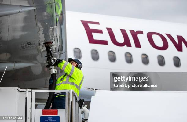 February 2023, Baden-Württemberg, Stuttgart: An Airbus A320 aircraft of the airline Eurowings is refueled with Jet A-1 kerosene at Stuttgart Airport....