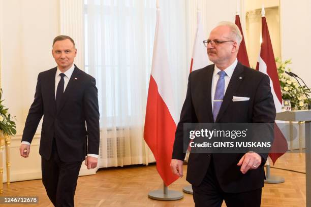 Latvia's President Egils Levits and Poland's President Andrzej Duda arrive to a joint press conference at the Riga Castle in Riga, Latvia, on...