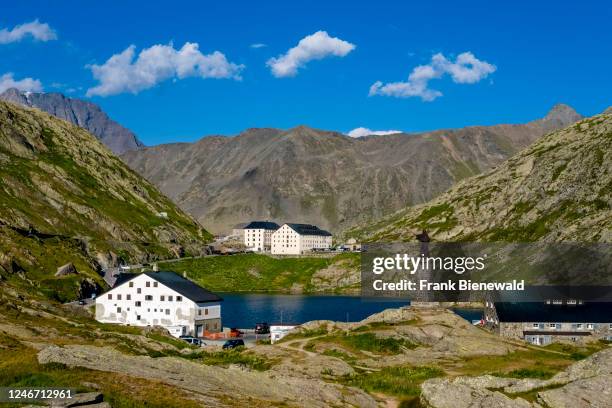 The lake Lac du Grant Saint-Bernard, buildings and alpine scenery on top of the Great St Bernard Pass.