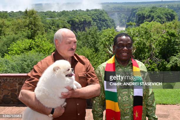 Belarus' President Alexander Lukashenko and Zimbabwean President Emmerson Mnangagwa visit the Victoria Falls on the Zambezi River, on the border with...