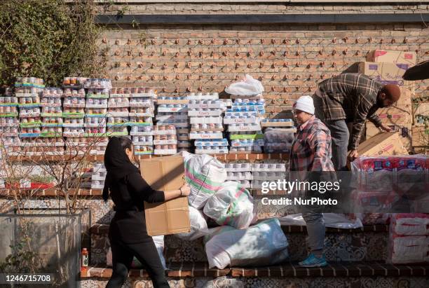 Iranian volunteers collect and adjust people's donations for helping victims of earthquake in the border city of Khoi, in the RooBeRoo mansion cafe...