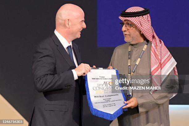 President Gianni Infantino poses for a picture AFC President Salman bin Ibrahim al-Khalifa during the 33rd Asian Football Confederation Congress at...