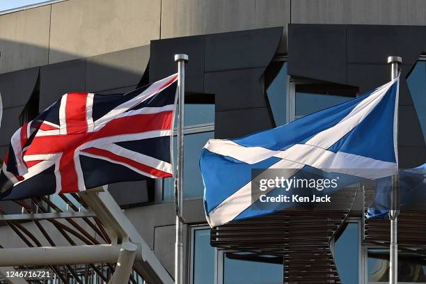 The Scottish saltire and union flag fly outside the front entrance of the Scottish Parliament, which is closed to the public for a day, due to...