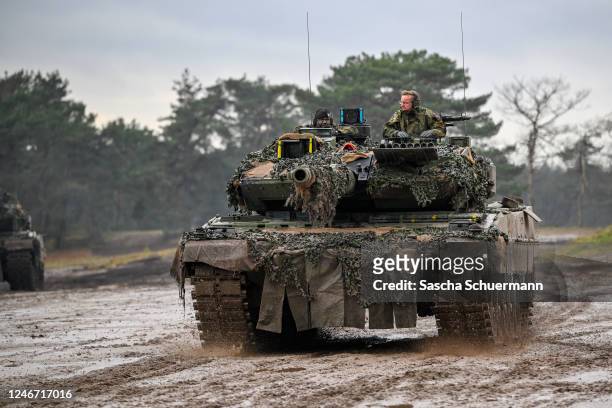 German Defence Minister Boris Pistorius rides in a Leopard 2 A6 main battle tank during a visit to the Bundeswehr's Panzerbataillon 203 tank squadron...
