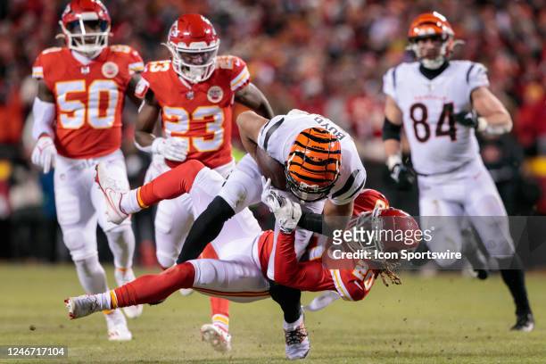 Kansas City Chiefs safety Justin Reid tackles Cincinnati Bengals wide receiver Tyler Boyd on January 29th, 2023 at Arrowhead Stadium in Kansas City,...