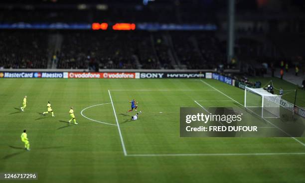 Barcelona's French forward Thierry Henry vies with Lyon French goalkeeper Hugo Lloris during the Champion's League football match Lyon vs Barcelona,...