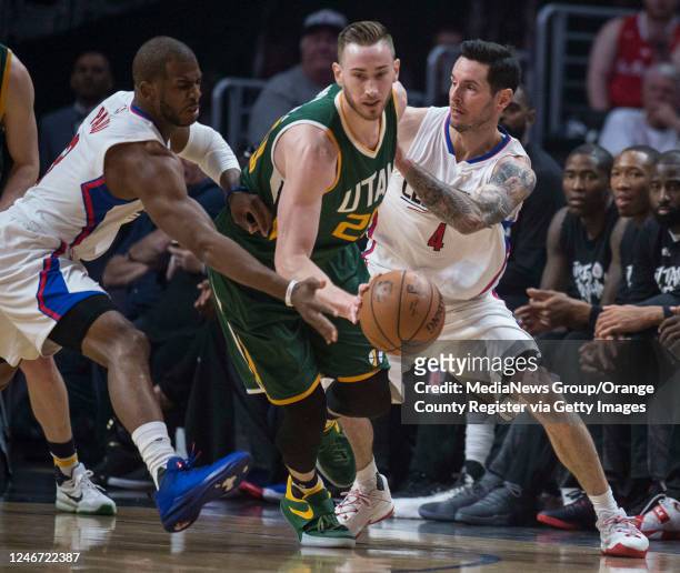 Clippers guard Chris Paul , left, and guard JJ Redick , right, defends Jazz forward Gordon Hayward during the game 7 of Western Conference...