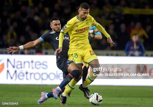 Marseille's French forward Dimitri Payet fights for the ball with Nantes' Brazilian defender Joao Victor during the French L1 football match between...