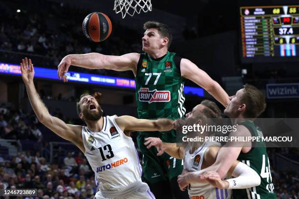 Panathinaikos Athens' Greek center Arturas Gudaitis and Real Madrid's Spanish guard Sergio Rodriguez battle under the basket during the Euroleague...