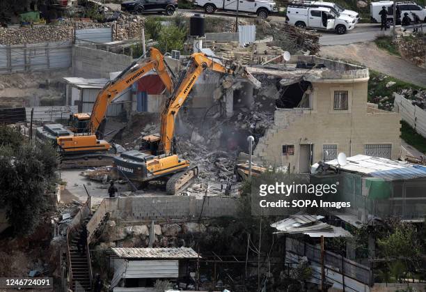 Heavy machinery demolishes the 4-storey house of the Jerusalemite Ratib Matar, in which 15 people lived, in the town of Jabal Mukaber, east of...
