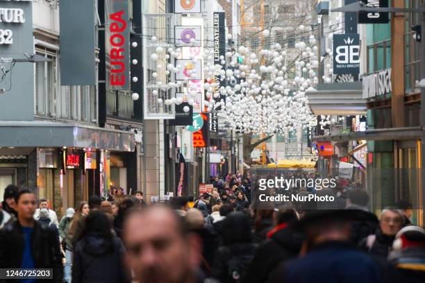 General view of the shopping crowd in the city center of Cologne, Germany on February 1, 2023 is seen as the state government starts removing the...
