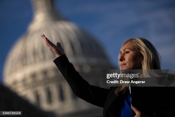 Rep. Marjorie Taylor Greene gestures toward an aide during a news conference outside the U.S. Capitol on February 1, 2023 in Washington, DC. Rep....