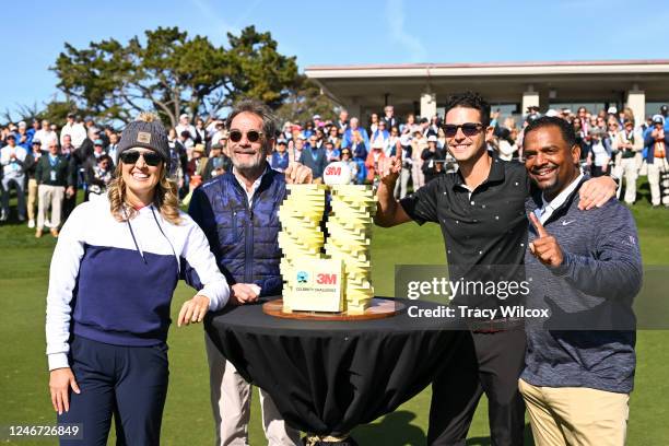 The winning team, Amanda Balionis Renner, Huey Lewis, Wells Adams, and Alfonso Ribeiro, pose with the trophy at The Hay prior to the AT&T Pebble...