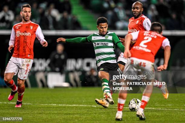 Sporting Lisbon's English forward Marcus Edwards kicks the ball and scores his team's third goal during the Portuguese league football match between...