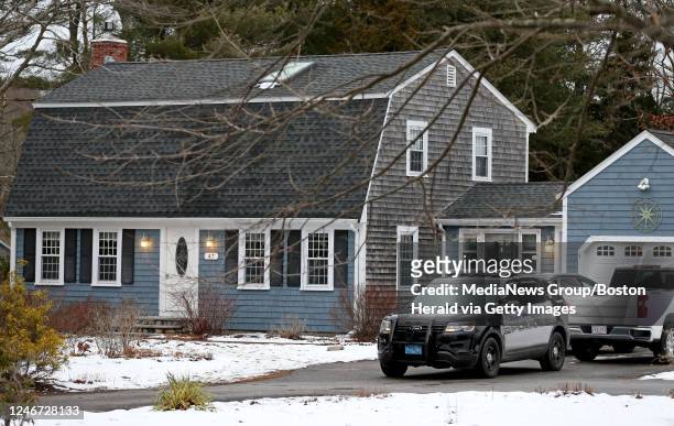 January 25: A police cruiser sits in the driveway at 47 Summer Street, the home of Lindsay Clancy who strangled her three children and then attempted...